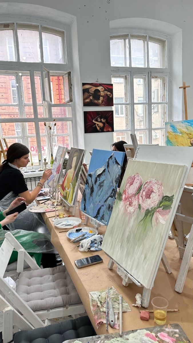 People painting during a Brushed Club event